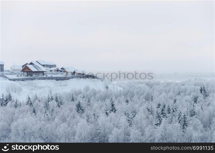 Country winter landscape, upper view of snowy forest, Malye Korely village, Arkhangelsk region, North Russia