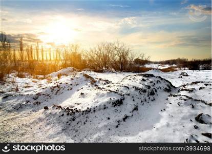 Countryside in winter at the bright sunrise