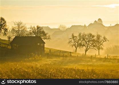 Countryside landscape golden morning fog in Prigorje region of Croatia