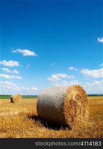 Countryside landscape with bales of hay