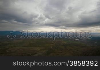 Countryside landscape with fast moving clouds, time-lapse, day