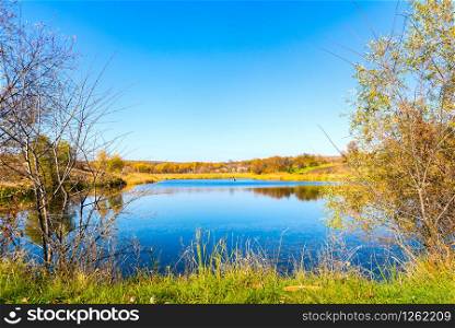Countryside river in autumn at warm sunny day. Countryside river in autumn