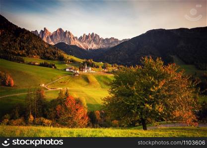 Countryside sunny view of the St. Magdalena, Santa Maddalena in the National Park Puez Odle or Geisler summits. Dolomites, South Tyrol. Italy, Europe.. Countryside sunny view of the St. Magdalena, Santa Maddalena in the National Park Puez Odle