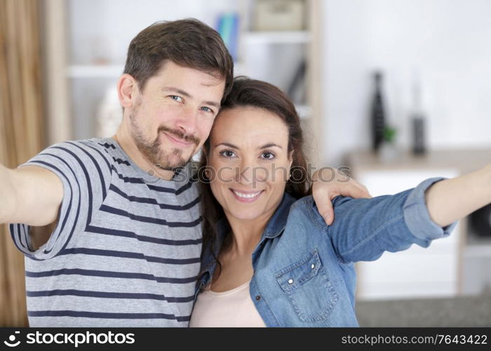 couple 30 years old taking a selfie with a smartphone