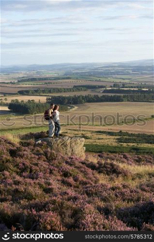Couple Admiring View On Countryside Walk