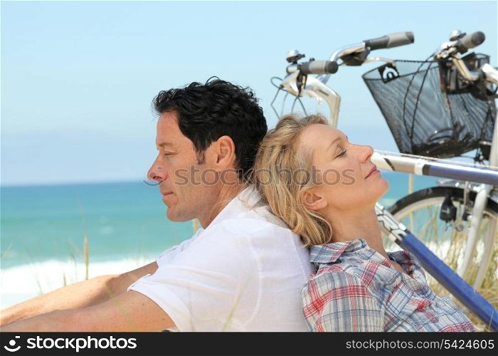 Couple alseep by the sea