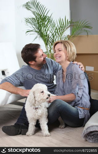 Couple and dog moving house