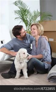 Couple and dog moving house