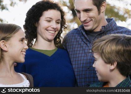 Couple and their two children smiling