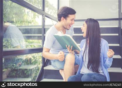 Couple asian handsome man and beautiful woman reading book and glad at home, boyfriend and girlfriend with activities together for leisure, education success concept.
