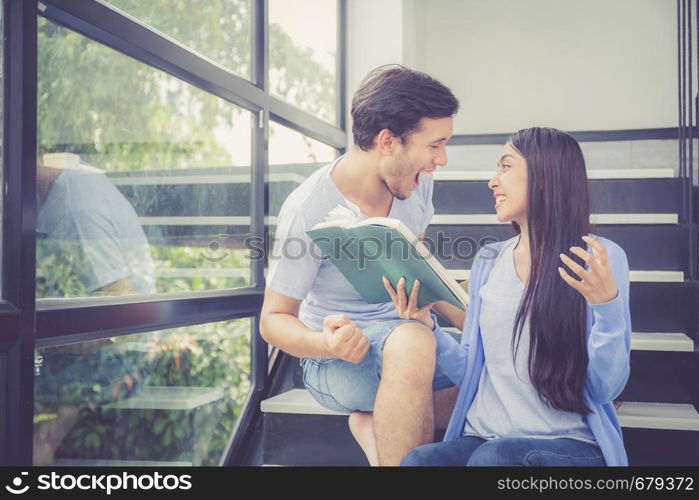 Couple asian handsome man and beautiful woman reading book and glad at home, boyfriend and girlfriend with activities together for leisure, education success concept.