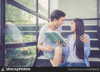 Couple asian handsome man and beautiful woman reading book and glad at home, boyfriend and girlfriend with activities together for leisure, education success concept.
