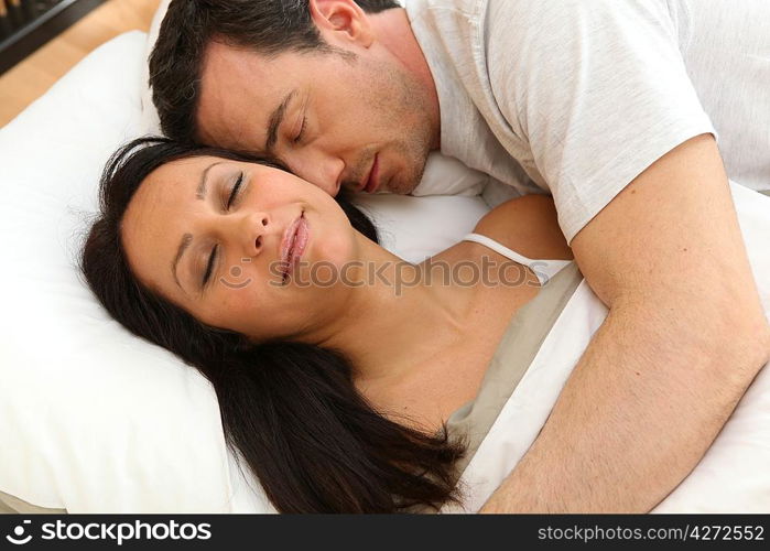 Couple asleep next to each other