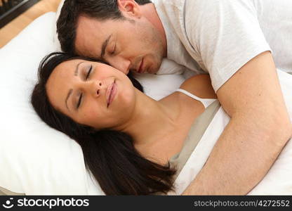 Couple asleep next to each other