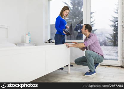 couple assembling bed