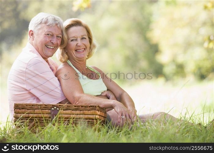Couple at a picnic smiling