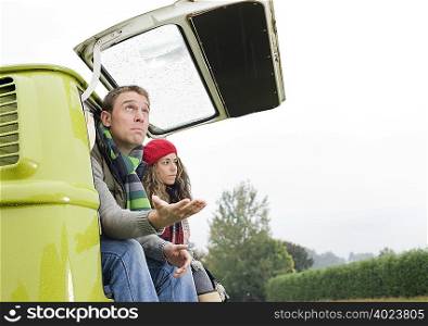 Couple at back of camper van