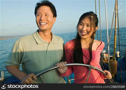 Couple at Helm of Boat