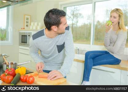 couple at home preparing food