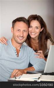 Couple at home surfing on internet