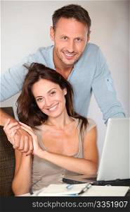 Couple at home surfing on internet