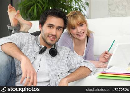 Couple at home with laptop