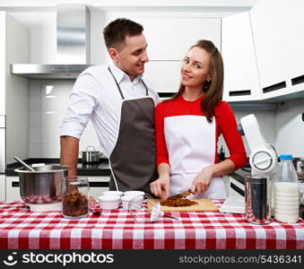 Couple at kitchen cooking together