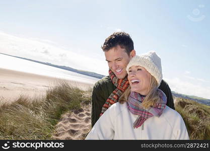 Couple at ocean smiling