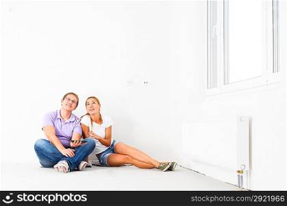 couple at their new empty apartment