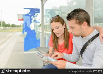 couple at tram stop