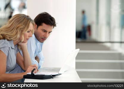 Couple at work on computer