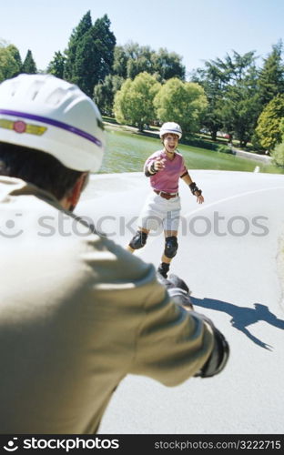 Couple Blading Towards Each Other