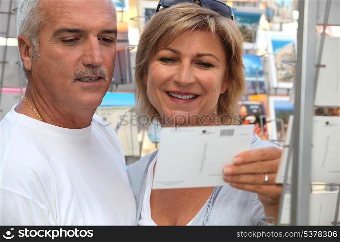 Couple buying post card