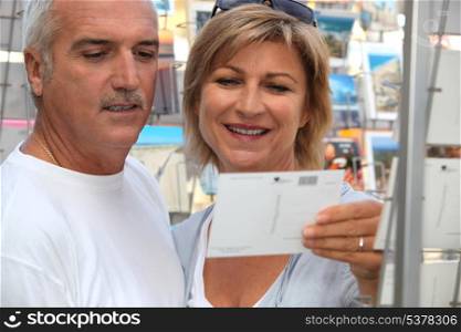 Couple buying post card