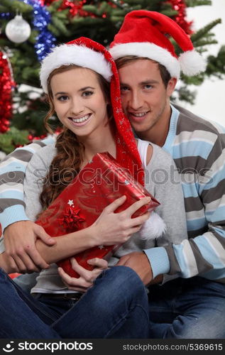 Couple by a Christmas tree