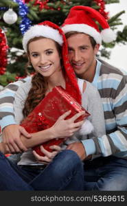 Couple by a Christmas tree