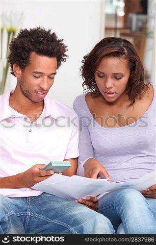 Couple calculating their budget