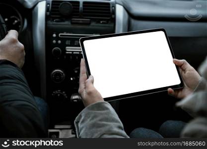 couple car consulting tablet while road trip