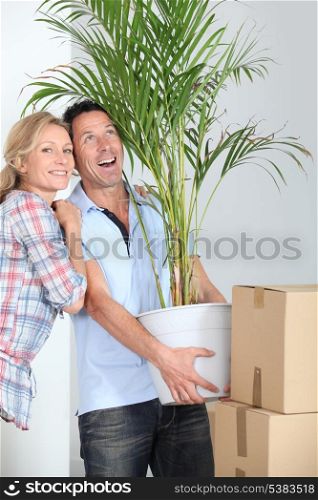 Couple carrying plant