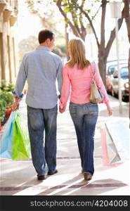 Couple carrying shopping