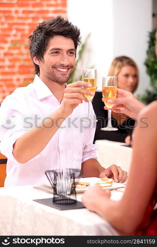 Couple celebrating in restaurant