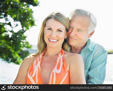 Couple cheek to cheek outdoors portrait