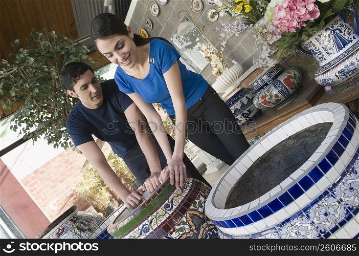 Couple choosing a flower pot