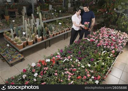 Couple choosing plants in a garden center