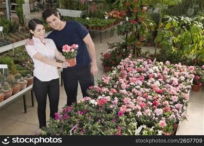 Couple choosing plants in a garden center