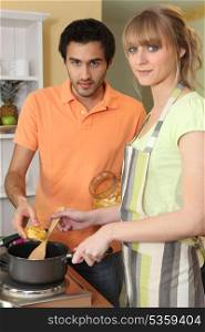 Couple cooking pasta