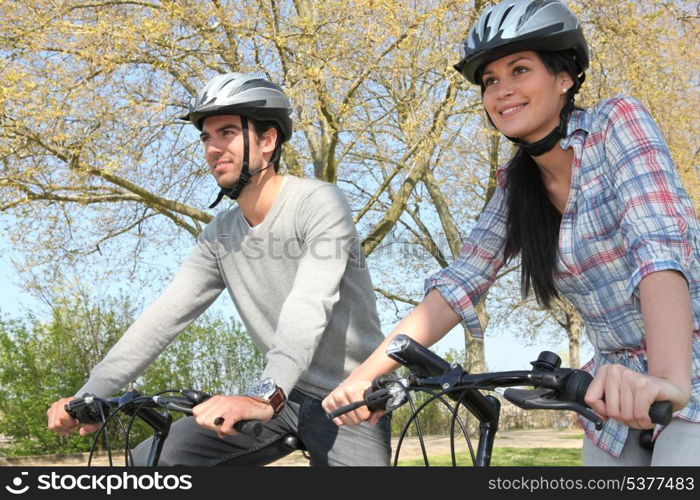 Couple cycling in autumn