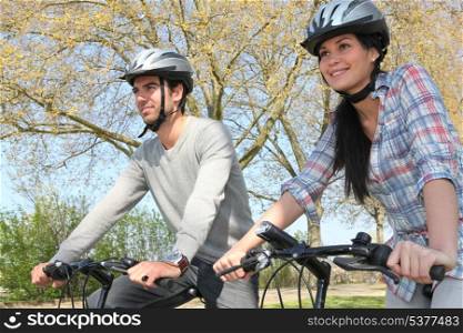 Couple cycling in autumn