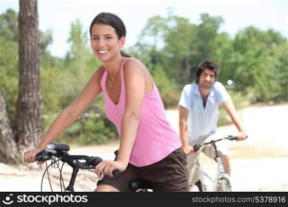 Couple cycling in the countryside