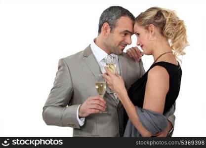 Couple dancing with glasses of champagne